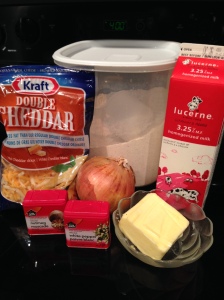 Sauce ingredients: whole milk, butter, onion, nutmeg, white pepper, flour, and cheddar cheese